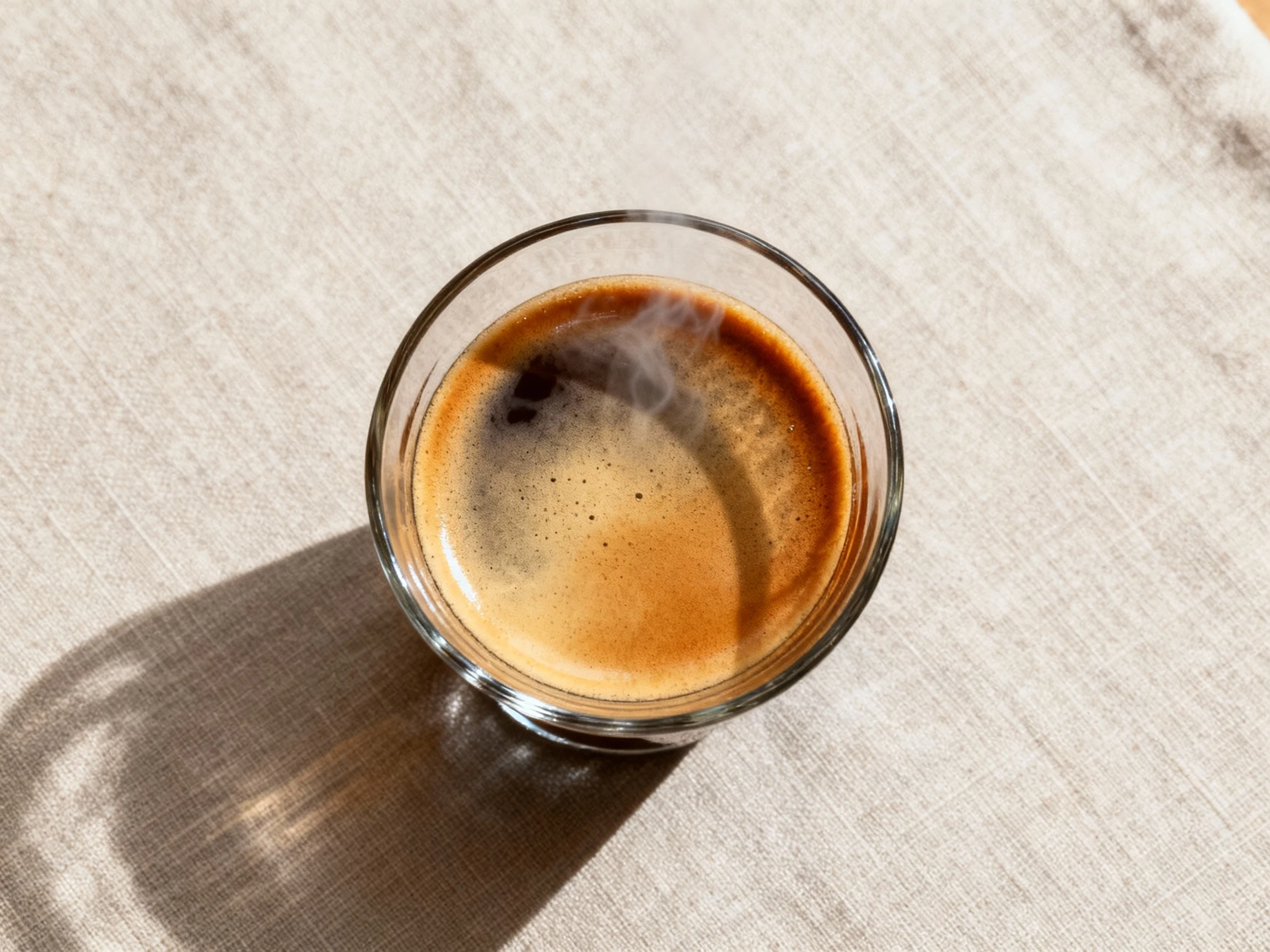 Food photography, Overhead shot of a classic Americano: hot water first with espresso poured on top for a layered look, 
