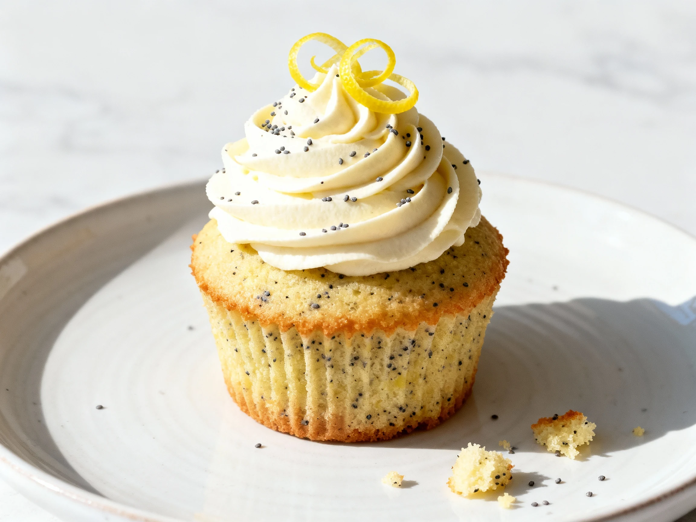 Food photography, Beautifully plated lemon–poppy seed cupcake with vanilla buttercream piped high, garnished with fresh