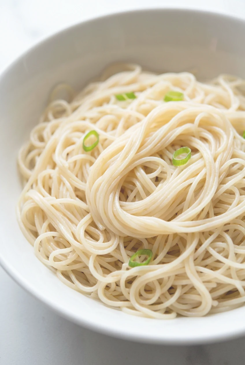 Cooking process: Charred sweet corn kernels sizzling in a black cast-iron skillet, lightly golden-browned edges with a g